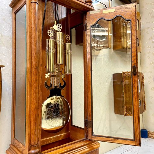 Đồng hồ tạ cây Howard Miller thùng sồi dáng mái sò 12/12 chơi 3 bản nhạc